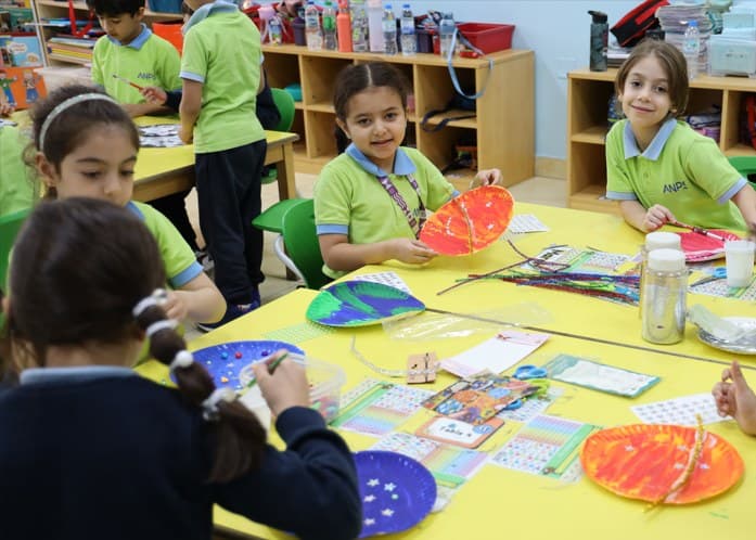 Children painting and creating during a creative learning activity