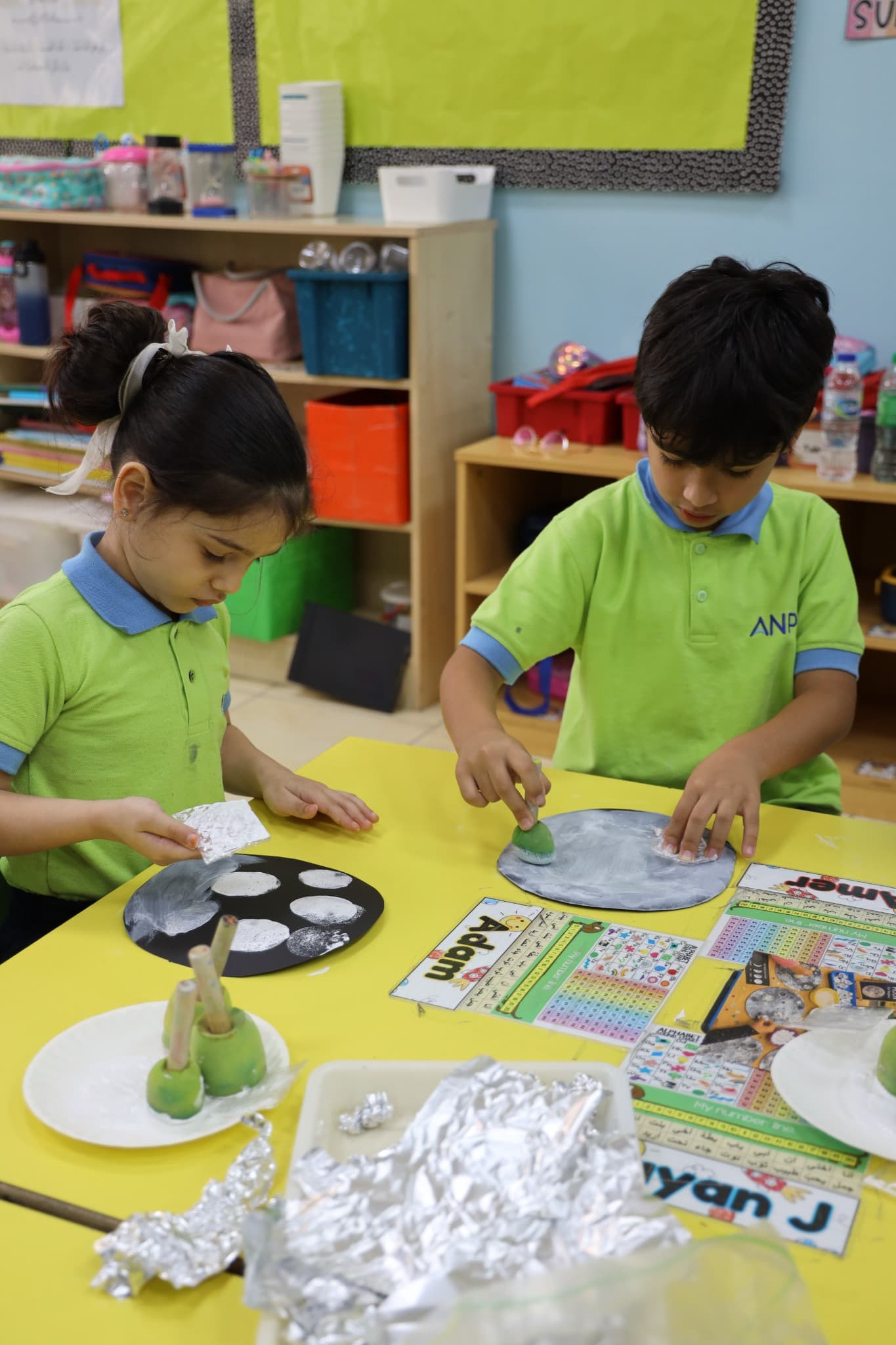 Children exploring real materials during a hands-on discovery activity