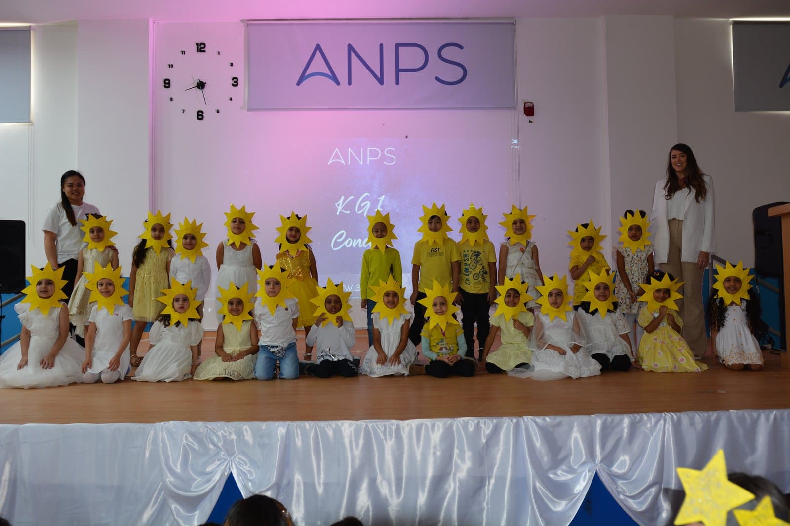 Primary students performing in an art, music and talent show