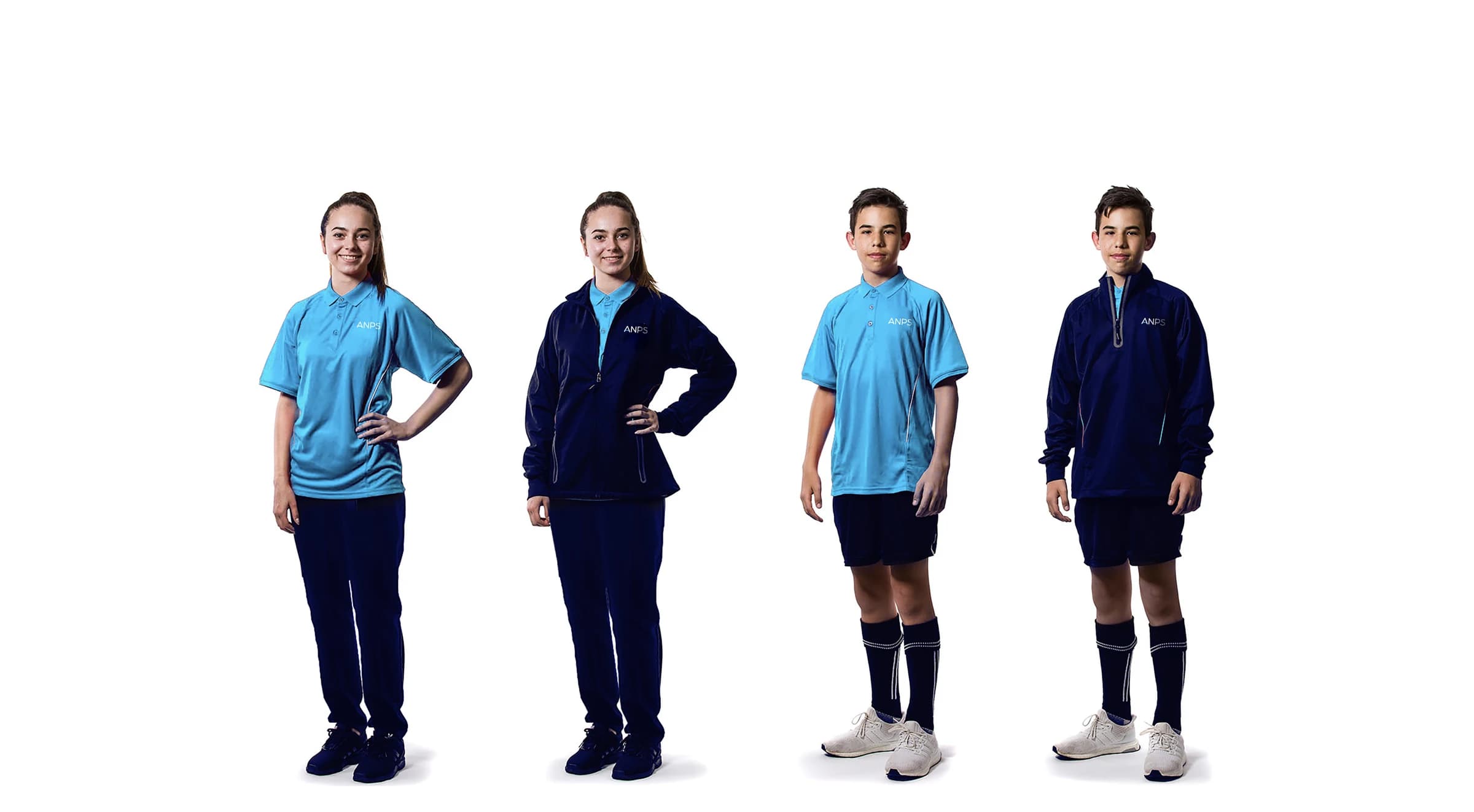 Al Najah Private School students wearing the full range of ANPS-branded uniforms — polo shirts, tracksuit jackets and sports kit
