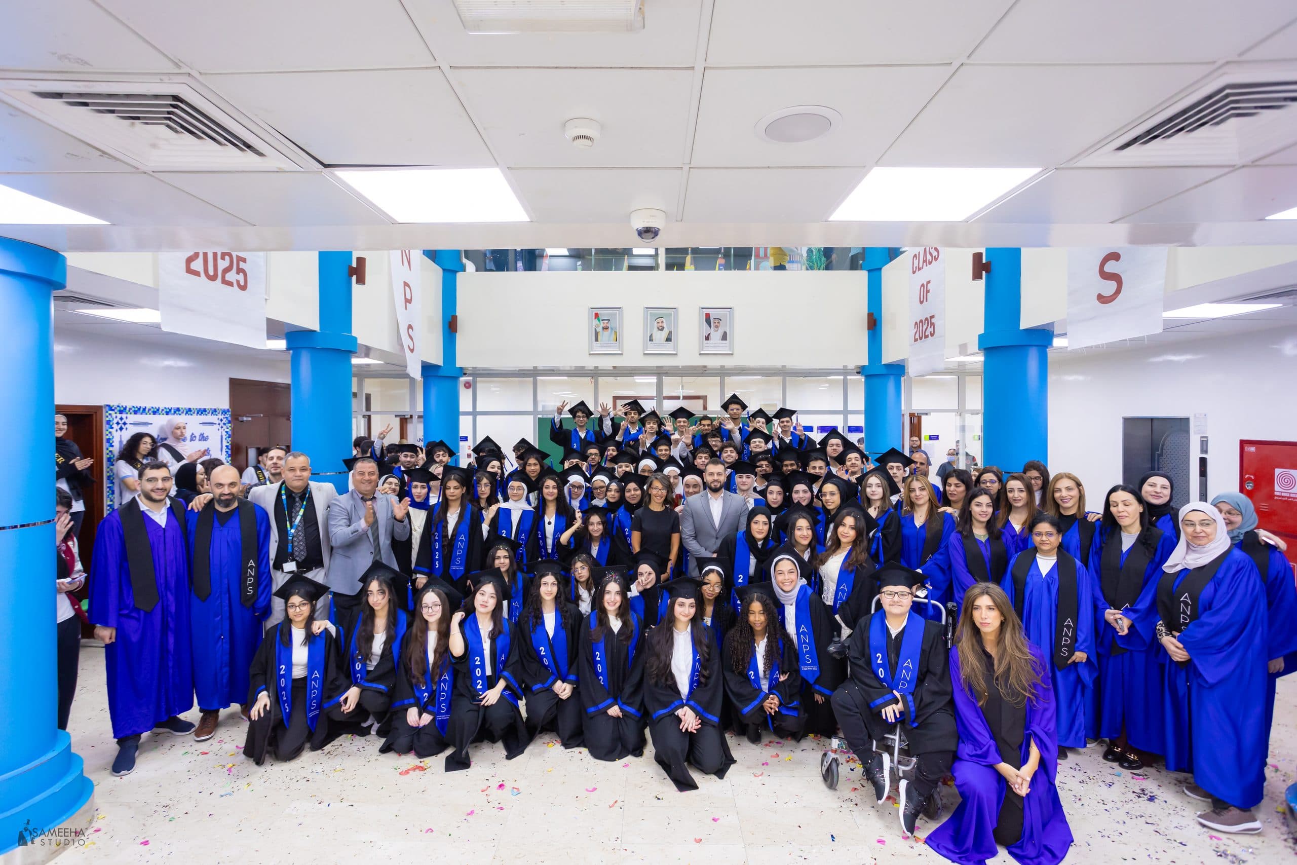 The Al Najah Private School Class of 2025 together in their graduation gowns and caps